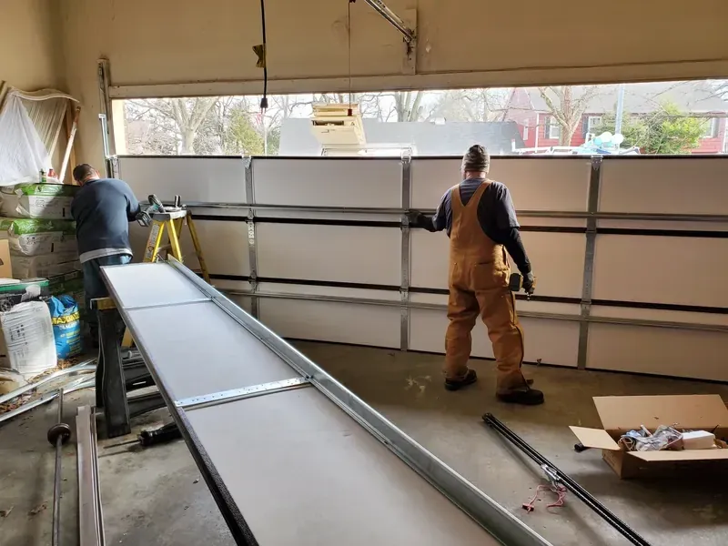 A Garage Door Masters KC technician on the job